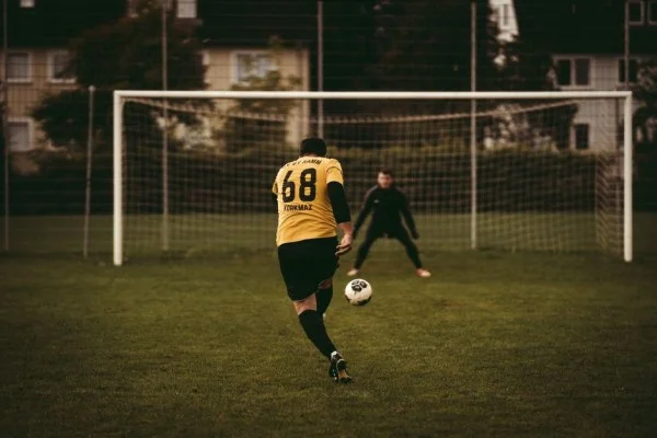 football striker shooting goal